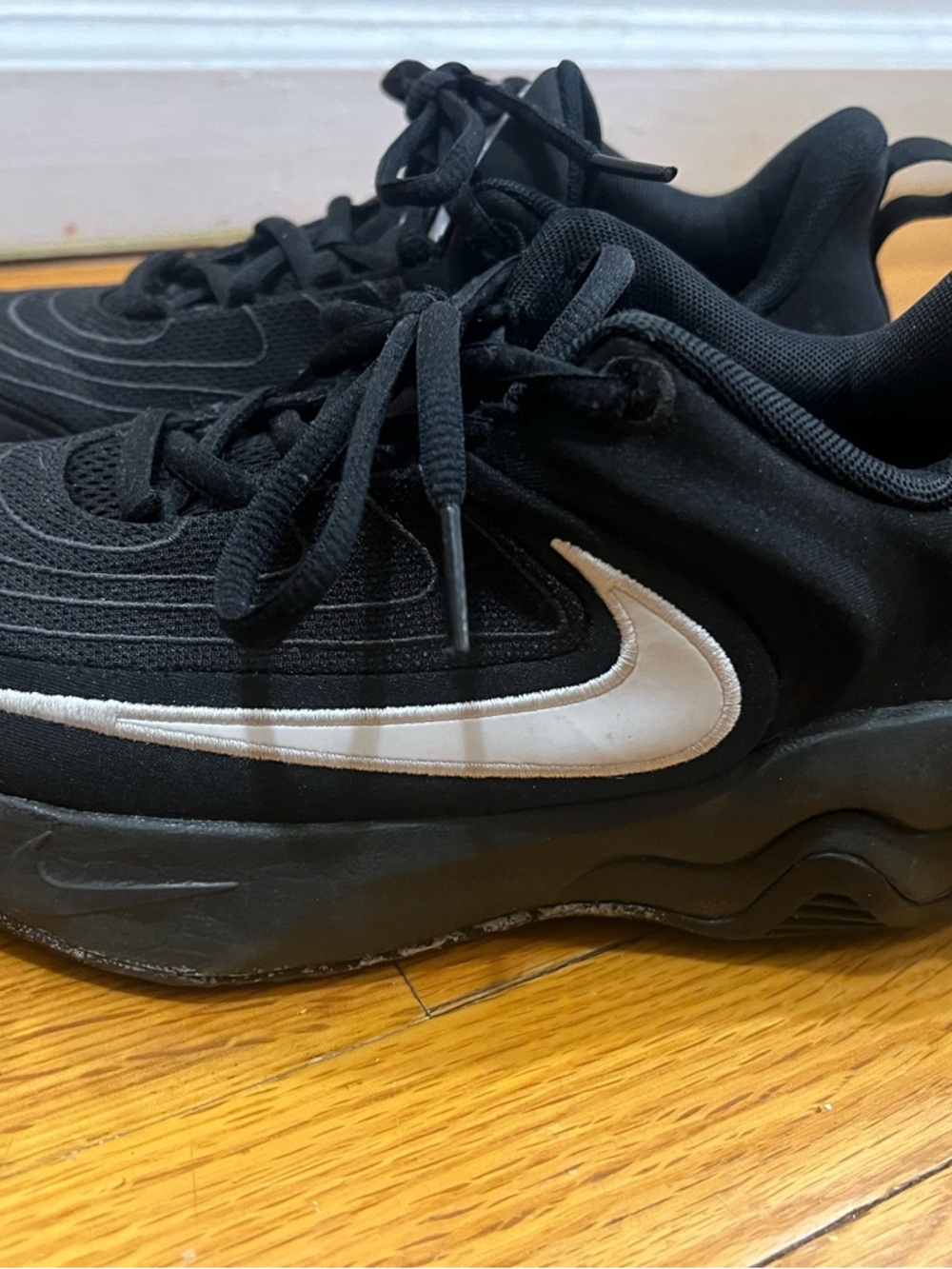 Nike Black Sneakers with White Swoosh Accent